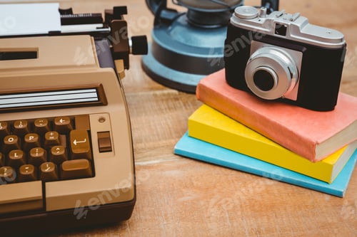Preview: Close up view of old camera and writer on wood plank