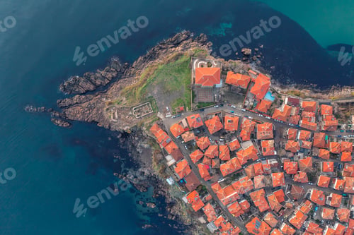 Preview: Top view of houses at rocky coastline