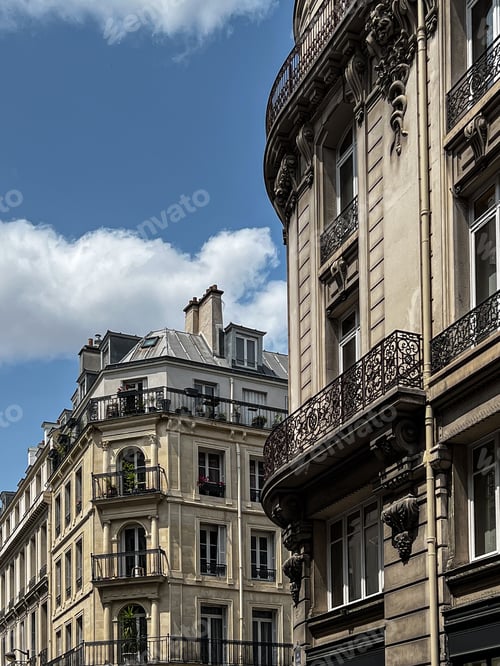 Preview: Facades of houses in Paris with balconies and shutters