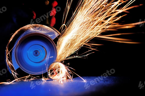 Preview: Worker cutting metal with grinder