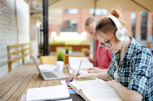 Preview: Focused Students Studying Together in a Cafe