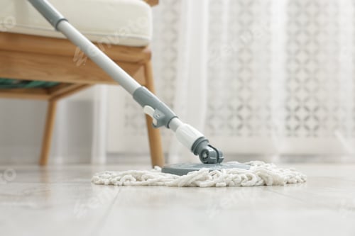 Preview: String mop on floor indoors. Cleaning equipment