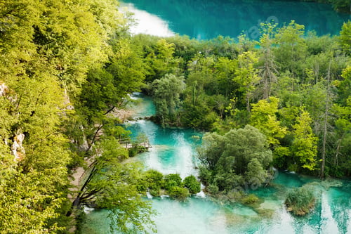 Preview: Breathtaking nature of deep blue lake surrounded by forests