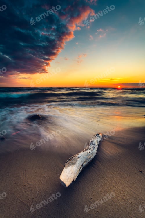 Preview: Vertical shot of beach sand at colorful sunset. Baltic Sea, Lithuania