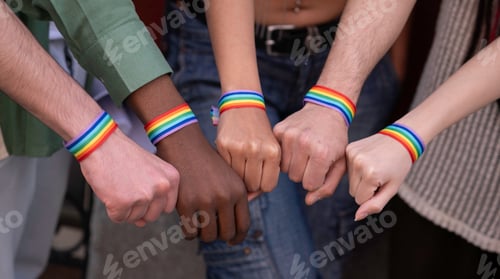 Preview: Activists showing support for lgbtq+ rights with rainbow bracelets