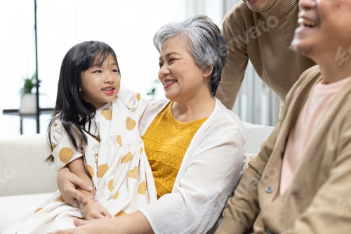 Preview: Asian multigenerational family spending happy time together at home
