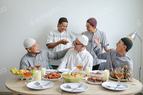 Preview: Portrait Of Multi Generation Muslim Family Laughing Together With Indonesian Traditional Food