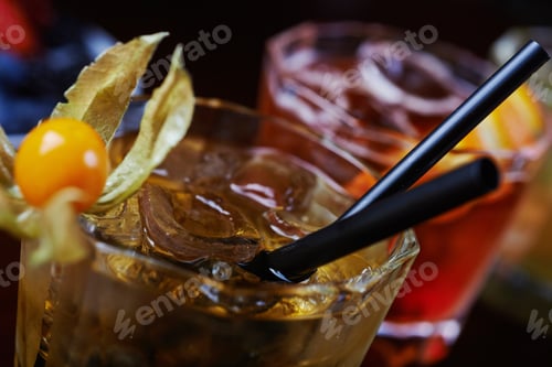 Preview: bright beautiful bright glass of alcoholic cocktail or lemonade on a table in a bar. soft focus.