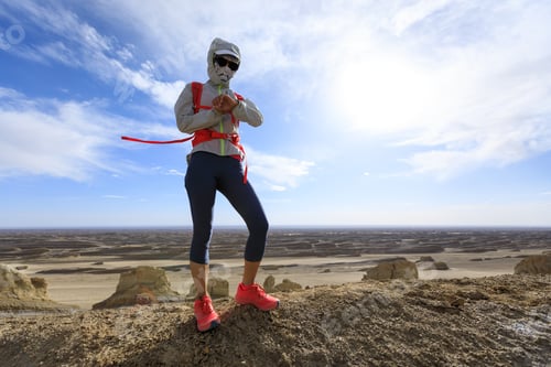 Preview: Woman trail runner cross country running on sand desert dunes
