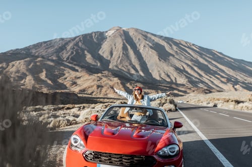 Preview: Woman traveling by car on the volcanic valley