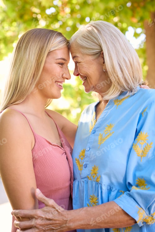 Preview: Portrait Of Multi-Generation Family With Senior Mother And Adult Daughter Laughing In Garden