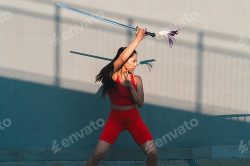 Preview: Chinese young woman practicing wushu kung fu.