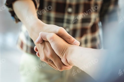 Preview: Handshake of businesspeople. Male and female hand makes a handshake in the office.