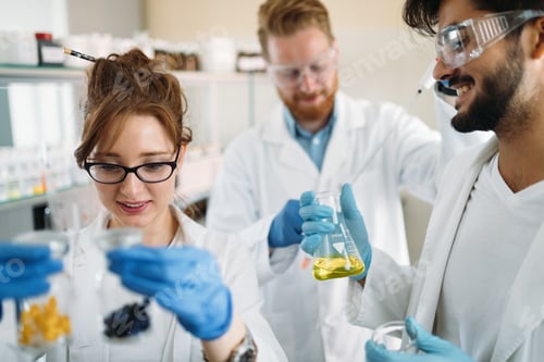 Preview: Group of scientists working at laboratory