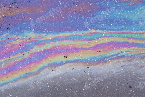 Preview: Gasoline spilled on the pavement. Space background picture. Mood.