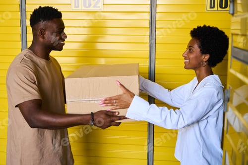 Preview: African American female gives her boyfriend cardboard box with things