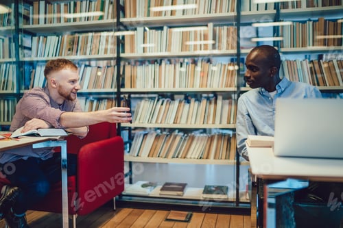 Preview: Colleagues speaking and using gadgets in library