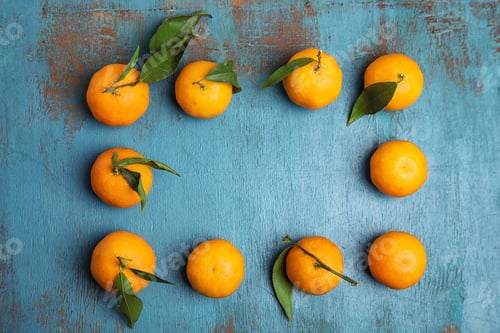 Preview: Fresh ripe tangerines and space for text on wooden background, top view