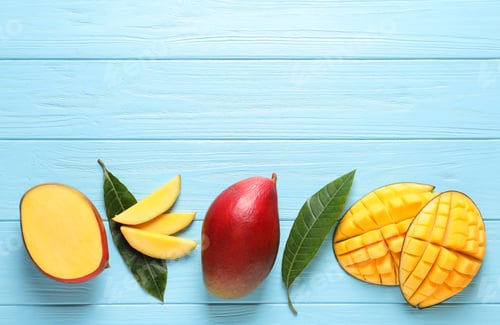 Preview: Flat lay composition with mango on color wooden background. Space for text