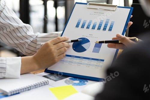 Preview: Business finance consultants discuss analysis of marketing reports profitability of the business.