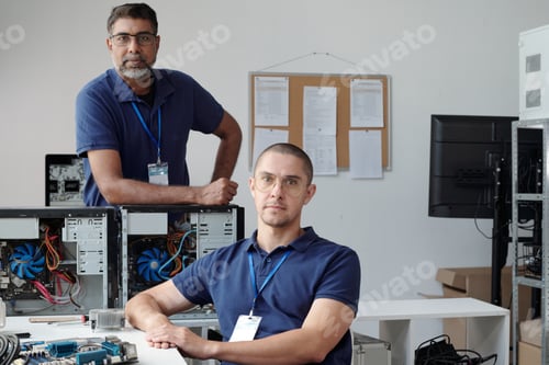 Preview: Portrait of Computer Technicians Examining Hardware Components