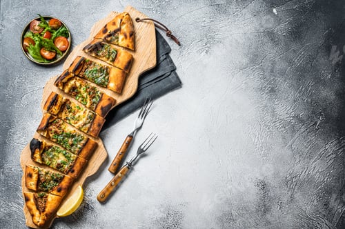 Preview: Turkish bread pide, Turkish pizza. White background. Top view. Copy space