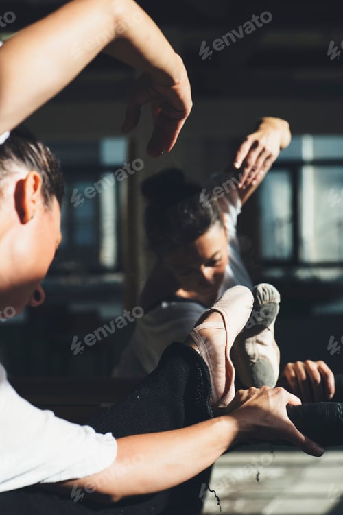 Preview: Ballet dancer women do flexibility exercises