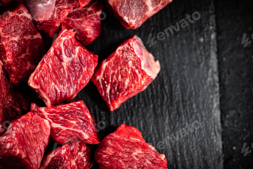 Preview: Pieces of raw beef on a stone board.
