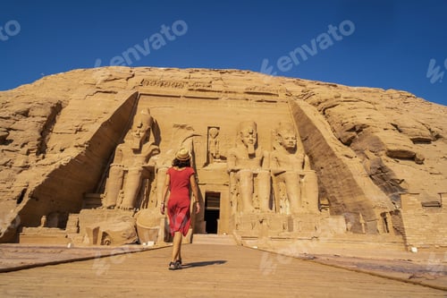 Preview: A European tourist in red dress at the Abu Simbel Temple in southern Egypt