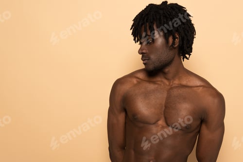 Preview: handsome african american shirtless man on beige