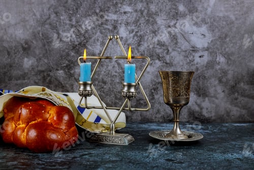 Preview: Sabbath Jewish Holiday homemade sesame challah bread and candelas on table