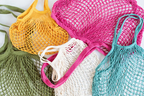 Preview: Assortiment of reusable cotton mesh bags or shoppers. Zero waste, plastic free concept