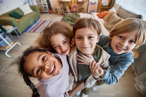 Preview: Group of happy children looking at camera together