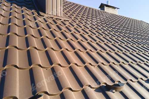 Preview: Closeup of house roof top covered with metallic shingles