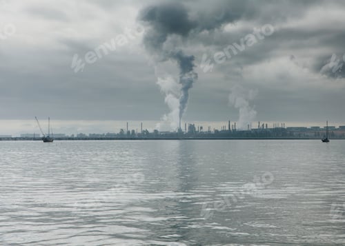 Preview: Smoke from oil refinery rising towards sky at Anacortes in Puget Sound. Washington, USA