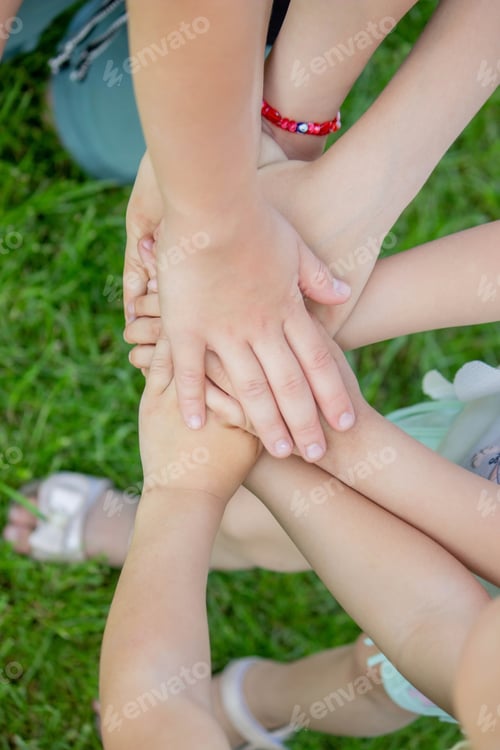 Preview: children, friends are playing in the garden, holding hands.
