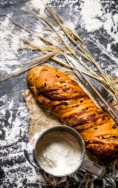 Preview: Ciabatta with flour and ears. On Board with flour.