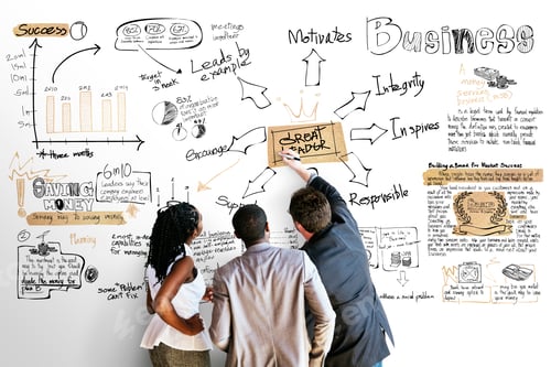 Preview: Team Brainstorming Business Strategy on Whiteboard