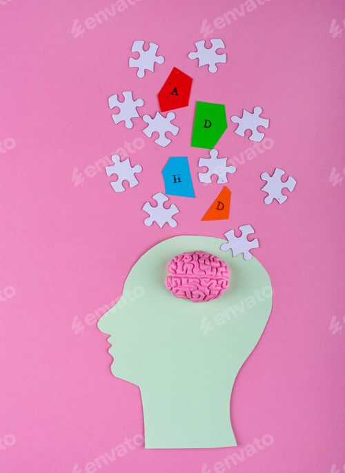 Colorful Brain Puzzle Pieces and Paper Head