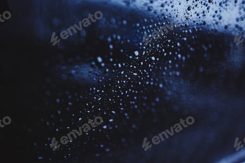 Preview: drops of water on the glass. rain outside the window. blue texture background. cloudy rainy day