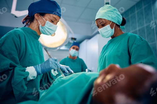 Preview: Female surgical team during an operation in the hospital.