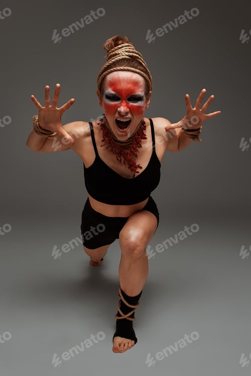Preview: close up portrait of young beautiful girl with colorful face painting. Halloween professional makeup