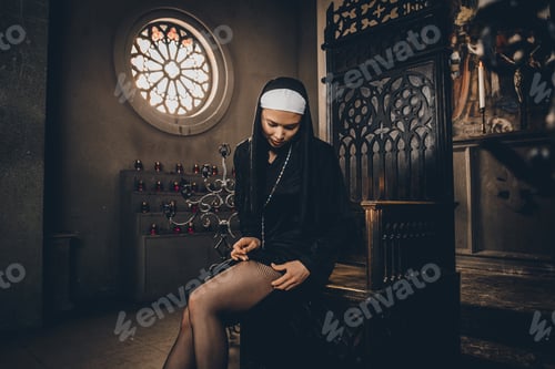 Preview: Nun praying in a monastery