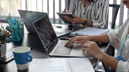 Preview: Business people discuss investment project working and planning strategy on laptop computer.