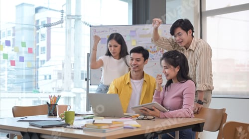 Preview: Startup business team celebrating corporate victory together in office.
