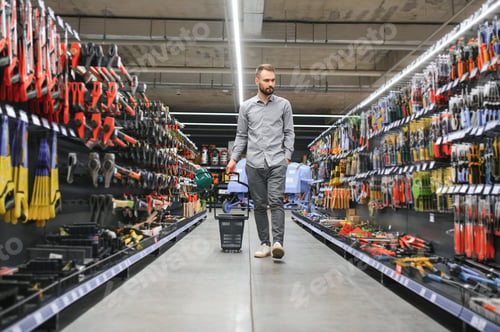 Preview: male builder in a hardware store