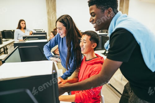 Preview: Young multiracial students using computers inside technology class at school room