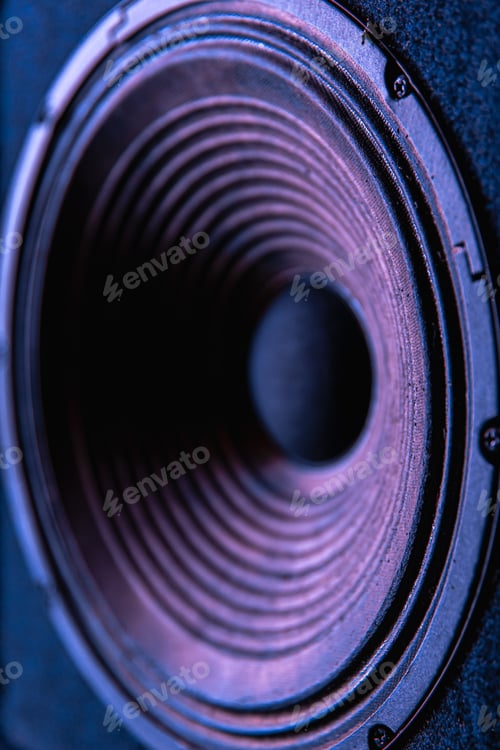Preview: Close-up of speaker membrane on black background.