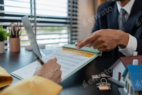 Preview: a real estate agent is explaining the details of a home purchase contract to a buyer