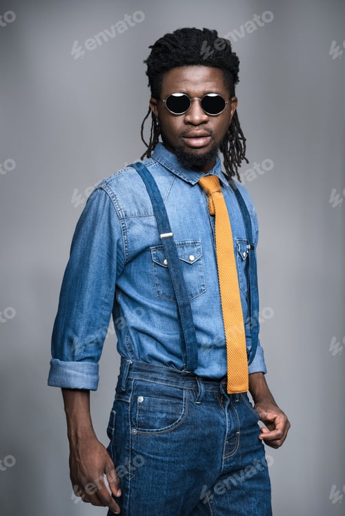 Preview: stylish african american man in black sunglasses isolated on gray
